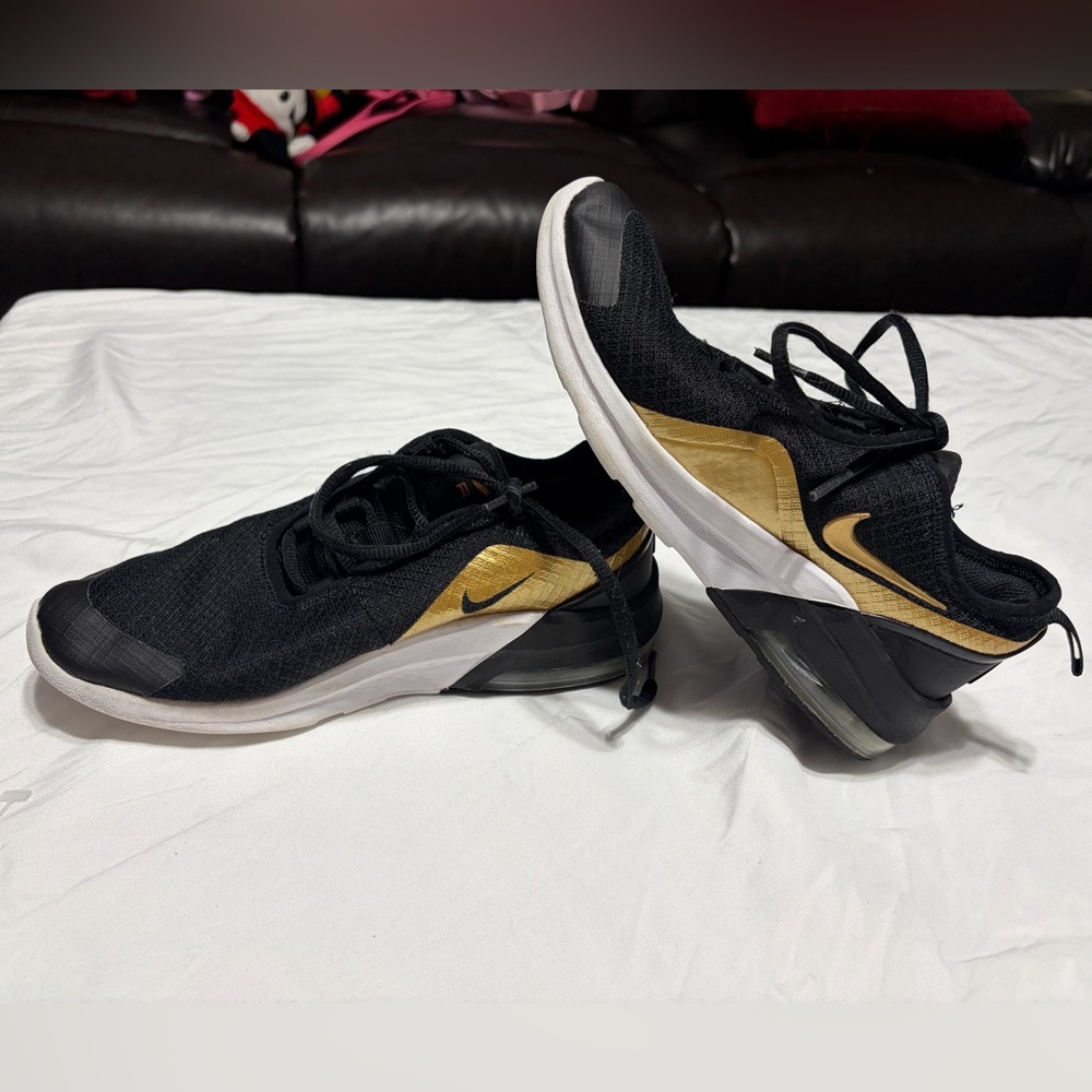 Nike Black Sneakers with Gold Accents